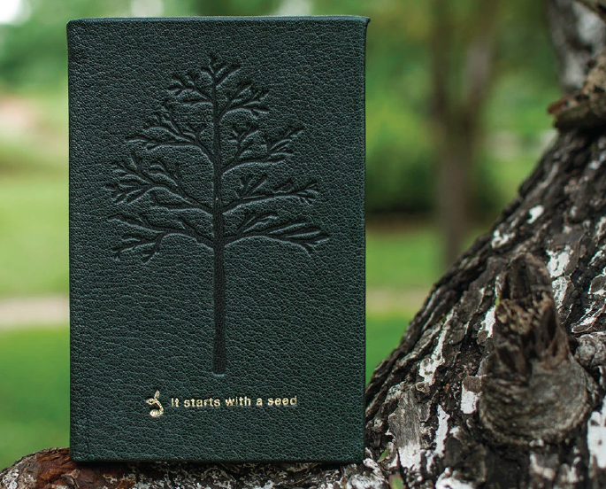 The finished leather-bound diary, embossed with a tree
