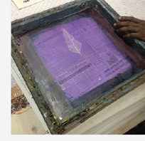 Ink pulled across the screen by hand
